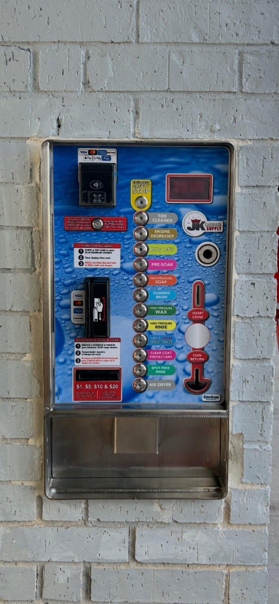 Wall-mounted JK Carwash Supply control panel installed in a wash bay