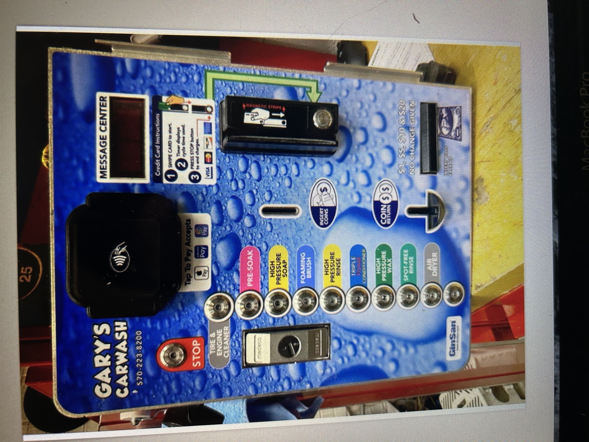 Blue self-serve carwash payment panel with buttons and card reader